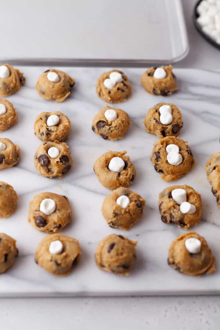 adding marshmallows to the cookies before baking