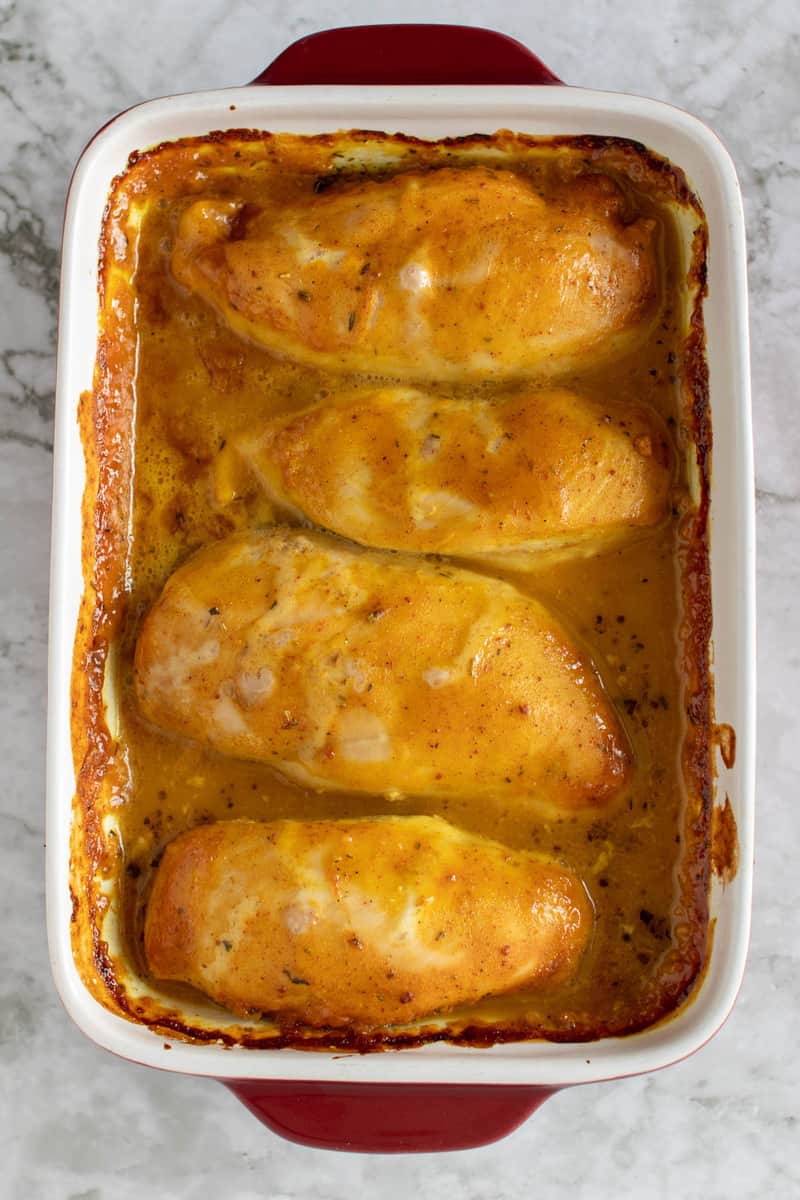 Honey Mustard Chicken in a red dish after baking