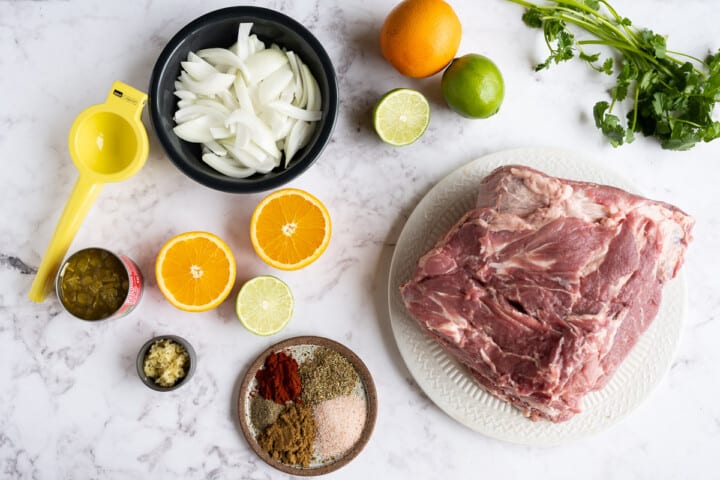 ingredients for pork carnitas on counter