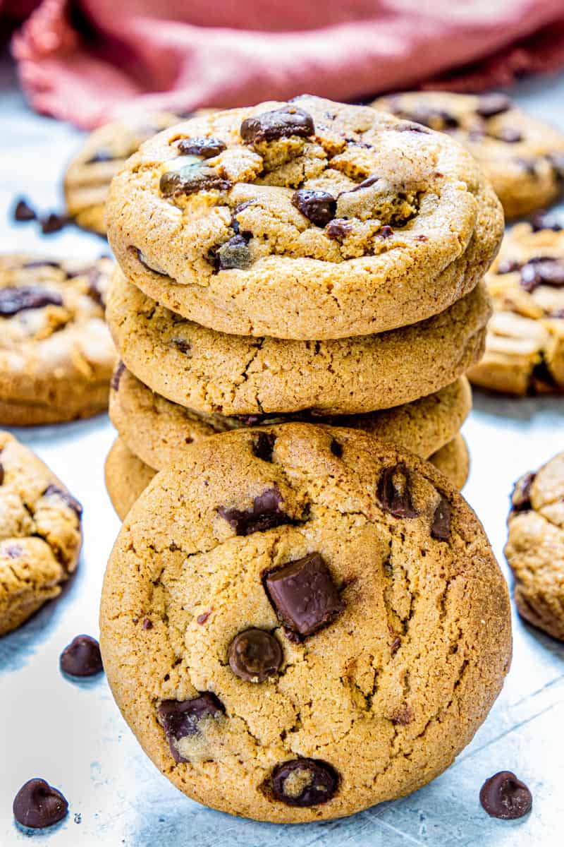 brown butter cookies stacked with one leaning on the stack