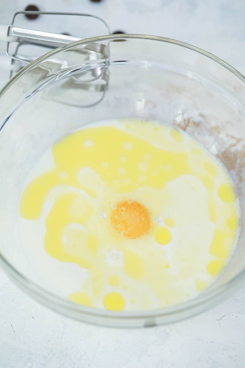 beating together the milk egg and butter