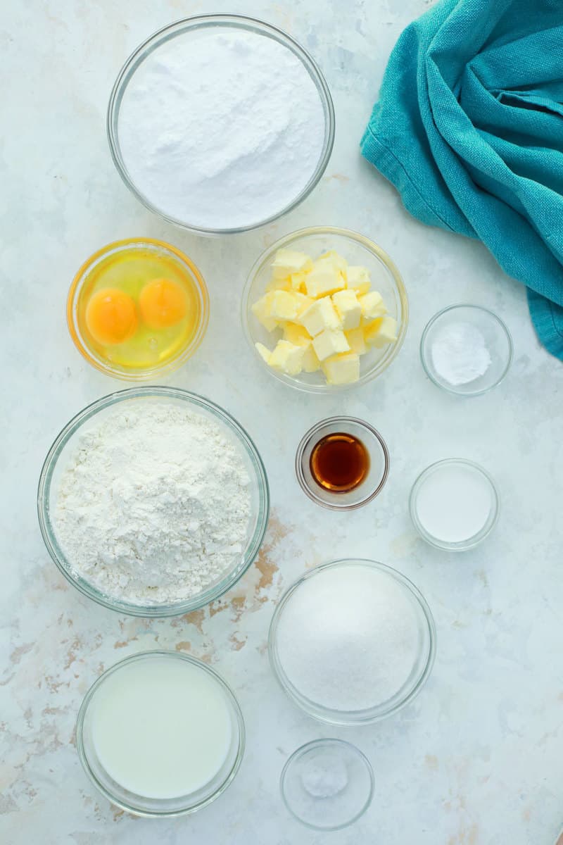ingredients for vanilla cupcakes in glass bowls