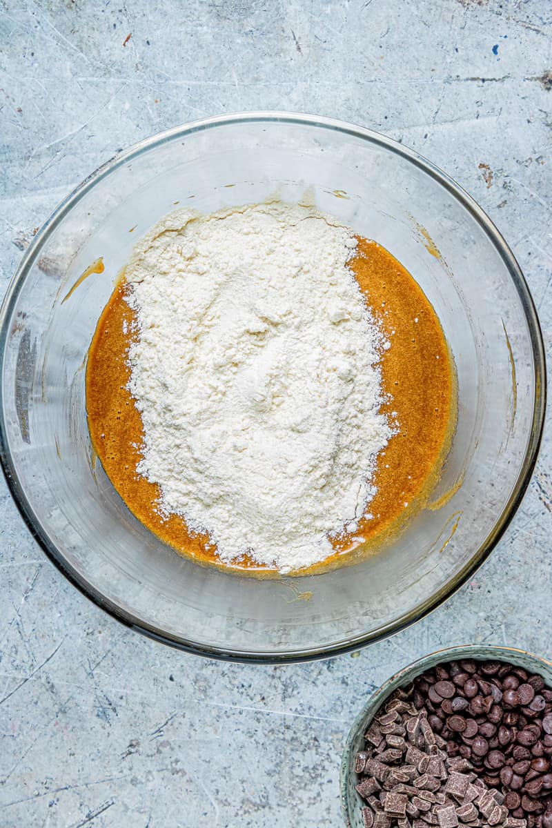 adding flour mixture to butter batter base