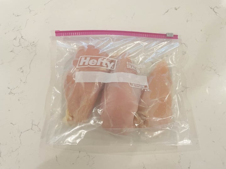 raw chicken breasts in a zip lock bag