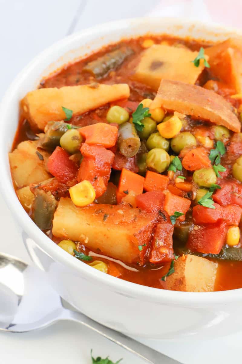 side shot photo of vegetable soup in white bowl