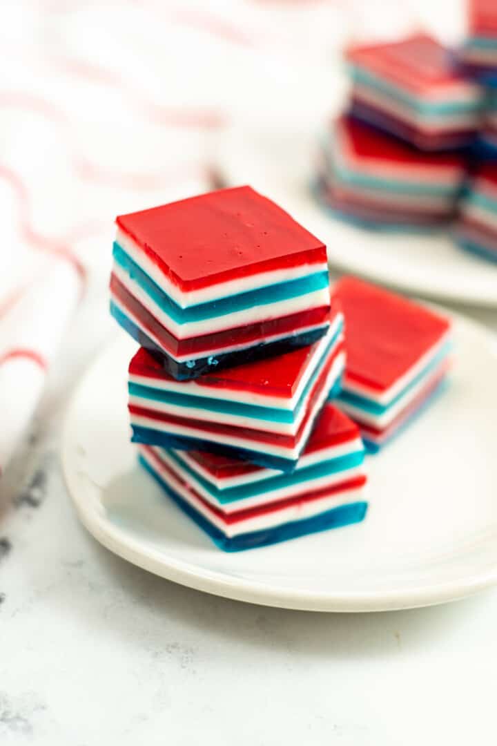 closeup of stacked Jello cubes on a white plate