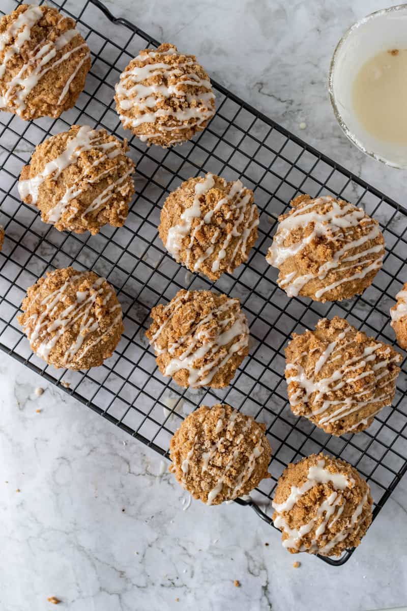 coffee cake muffins on wire rack with glaze