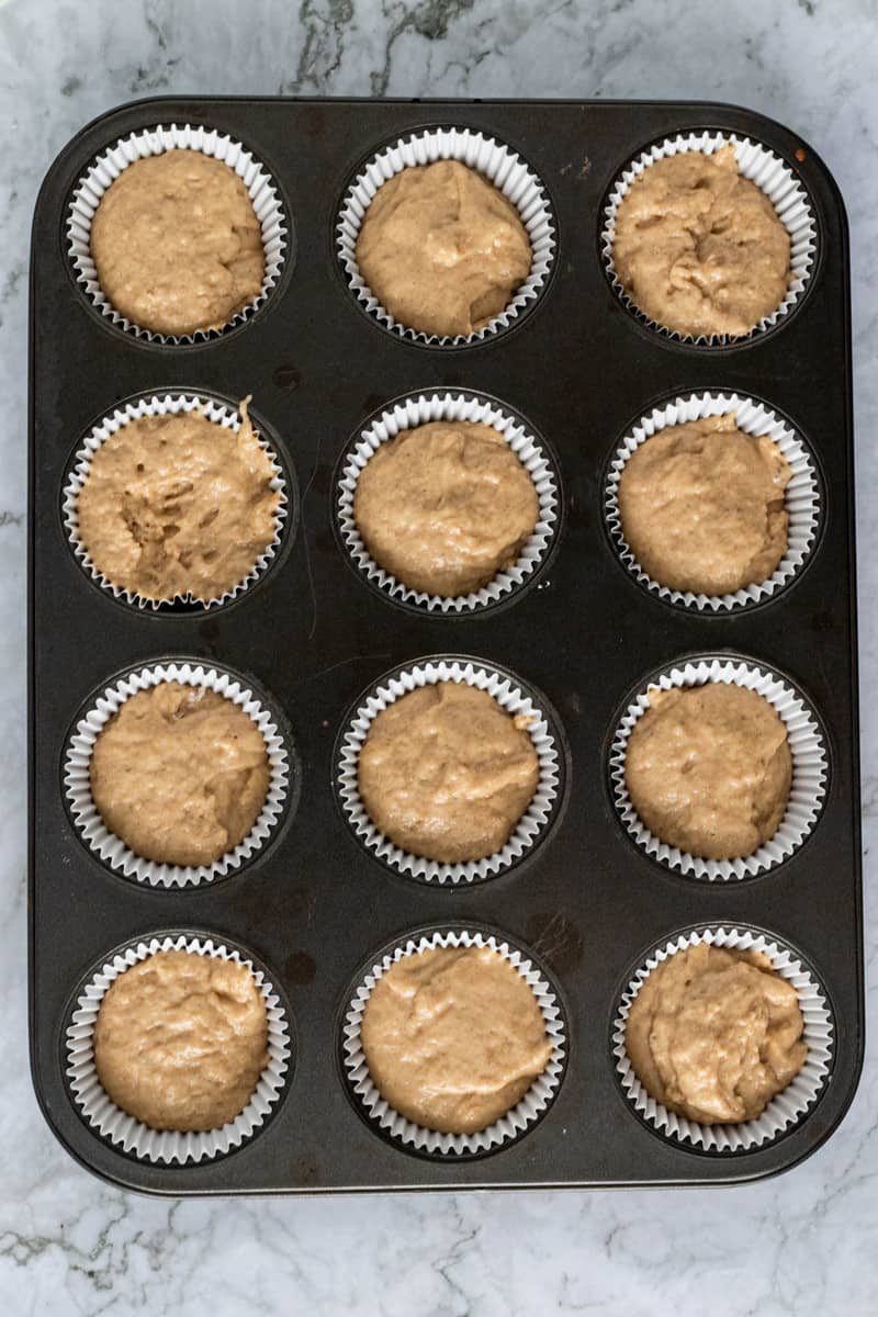 filling the muffin pan with the batter