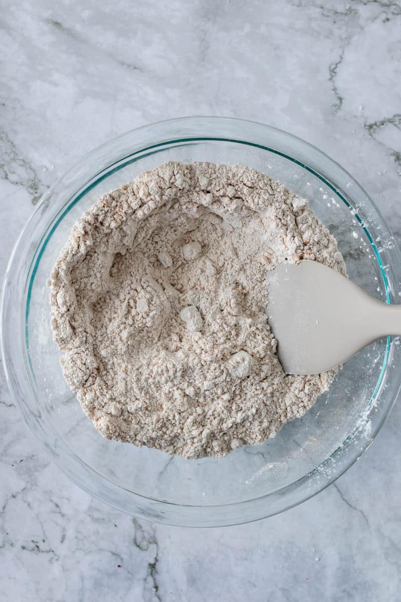 mixing the dry ingredients in a bowl for the dough