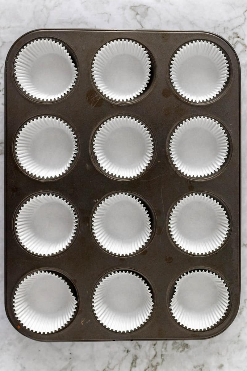 muffin baking pan lined with muffin liners