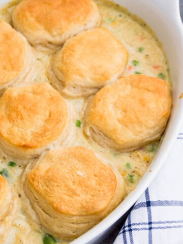 I love simple recipes like this Biscuit Chicken Pot Pie Casserole. It's classic comfort food made in casserole form. It doesn't get much better than that. I made a somewhat thicker version of the inside then places it on the bottom of a casserole dish.