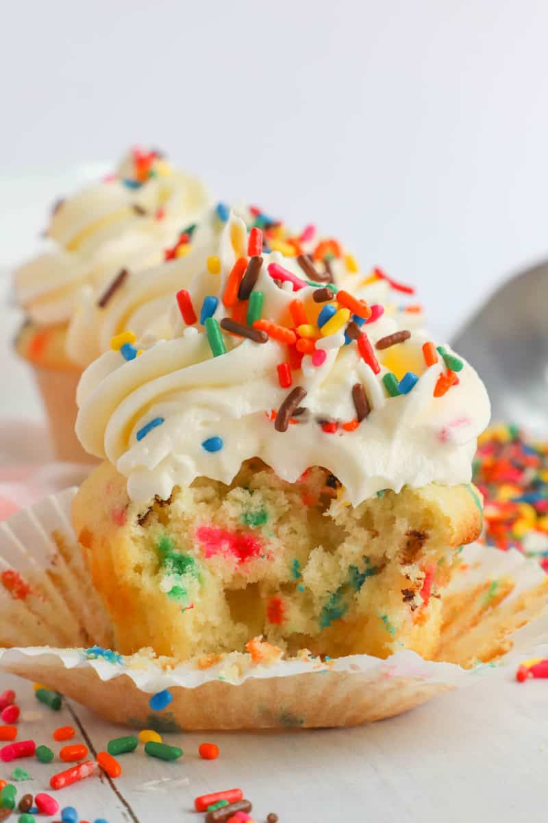 funfetti cupcake bit in half showing that side view