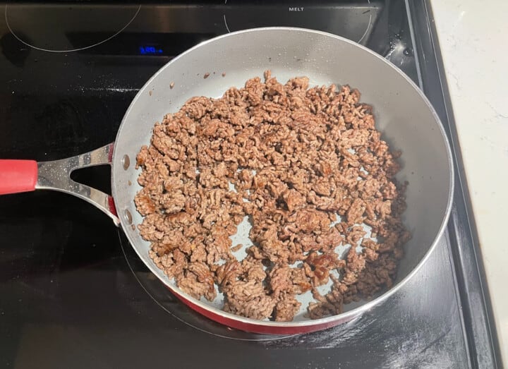 cooking ground beef in a skillet on stove top