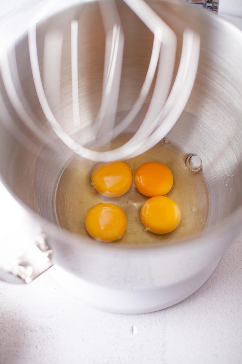 adding eggs to stand mixer.