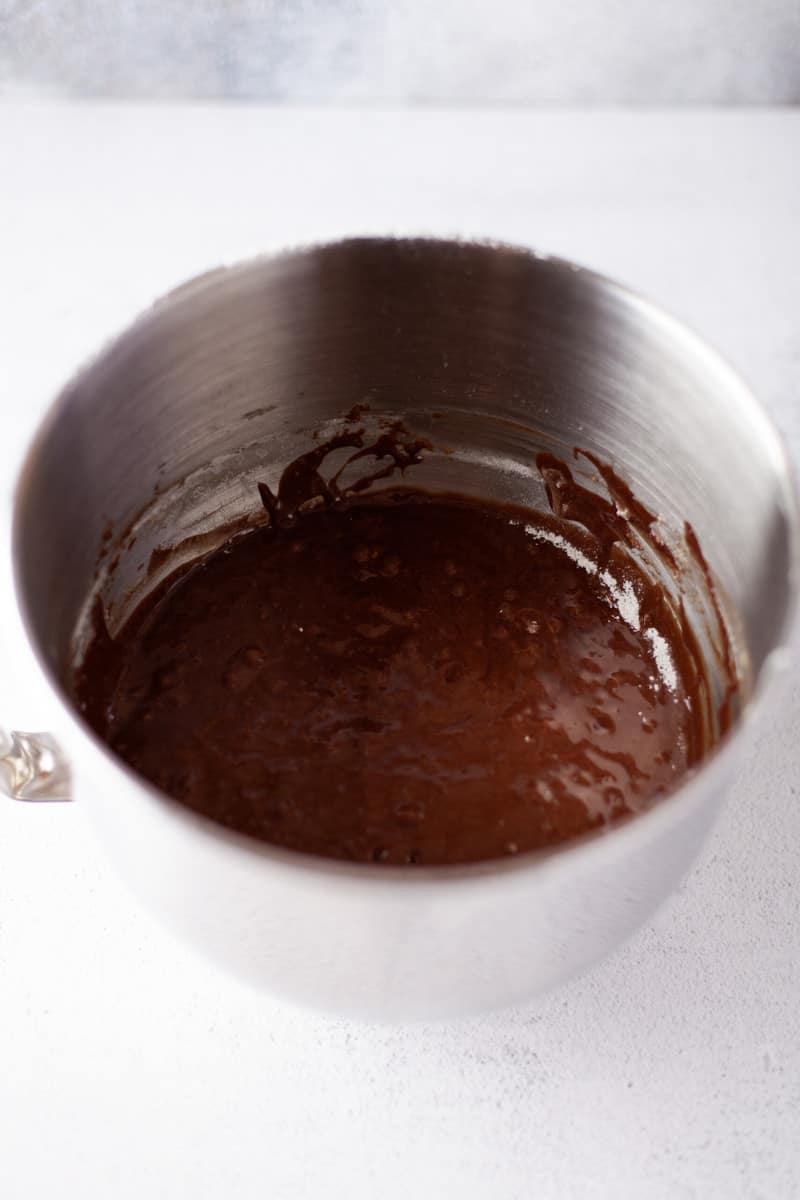 batter after adding butter and chocolate in mixer bowl.