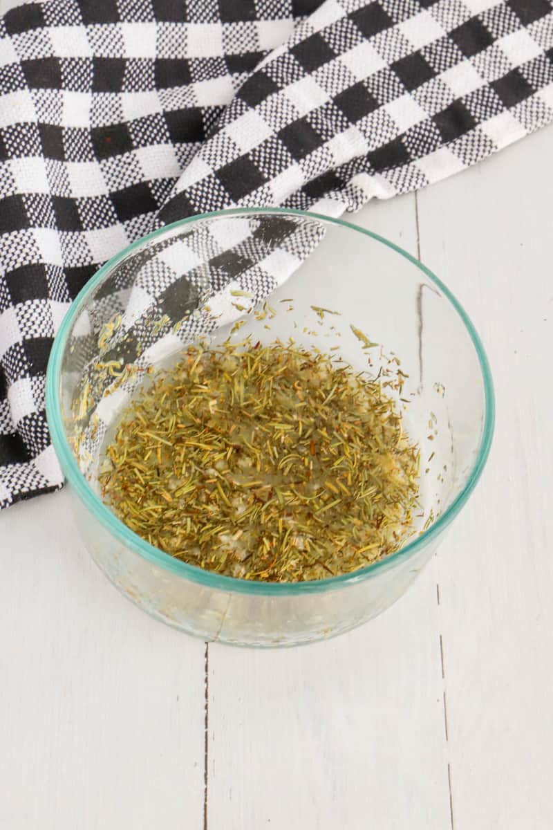 oil and spices mixed in small glass bowl