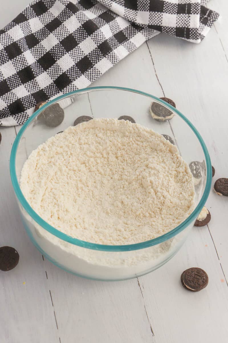 sifting flour in a glass bowl