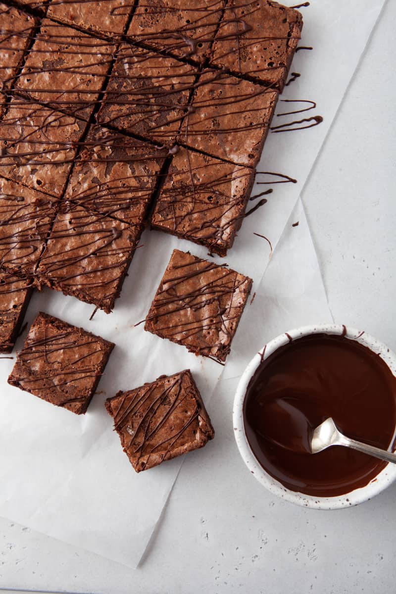 brownies sliced and drizzled with chocolate sauce.