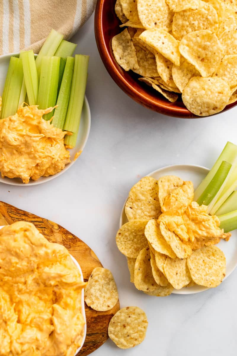 serving the buffalo chicken dip with celery and tortilla strips.