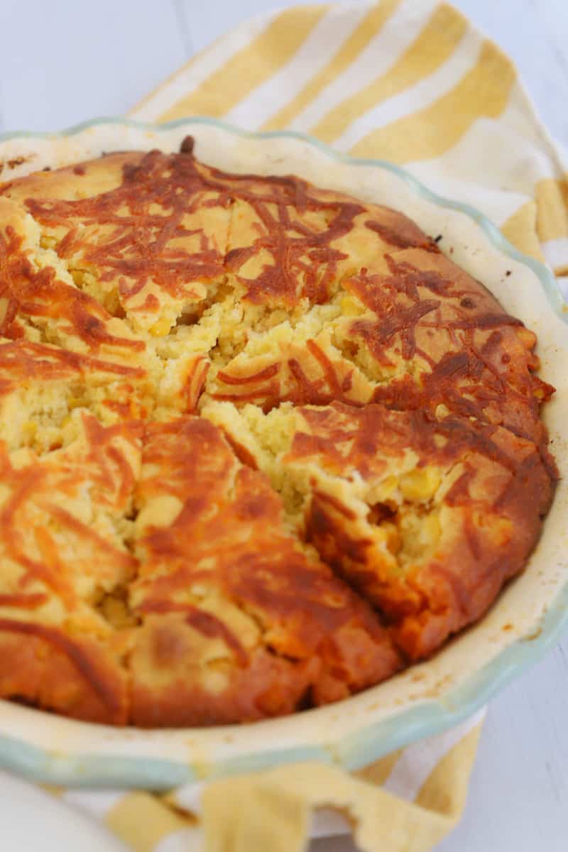 cornbread taco pie fully baked and sliced to serve