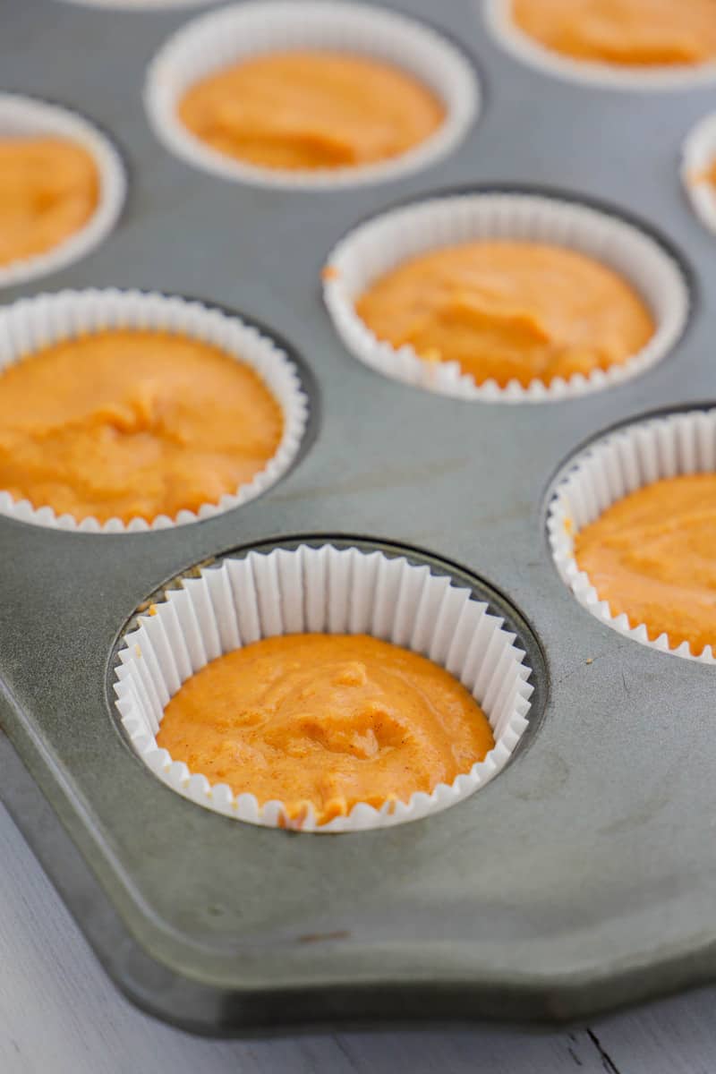 filling the cupcake liners with the batter