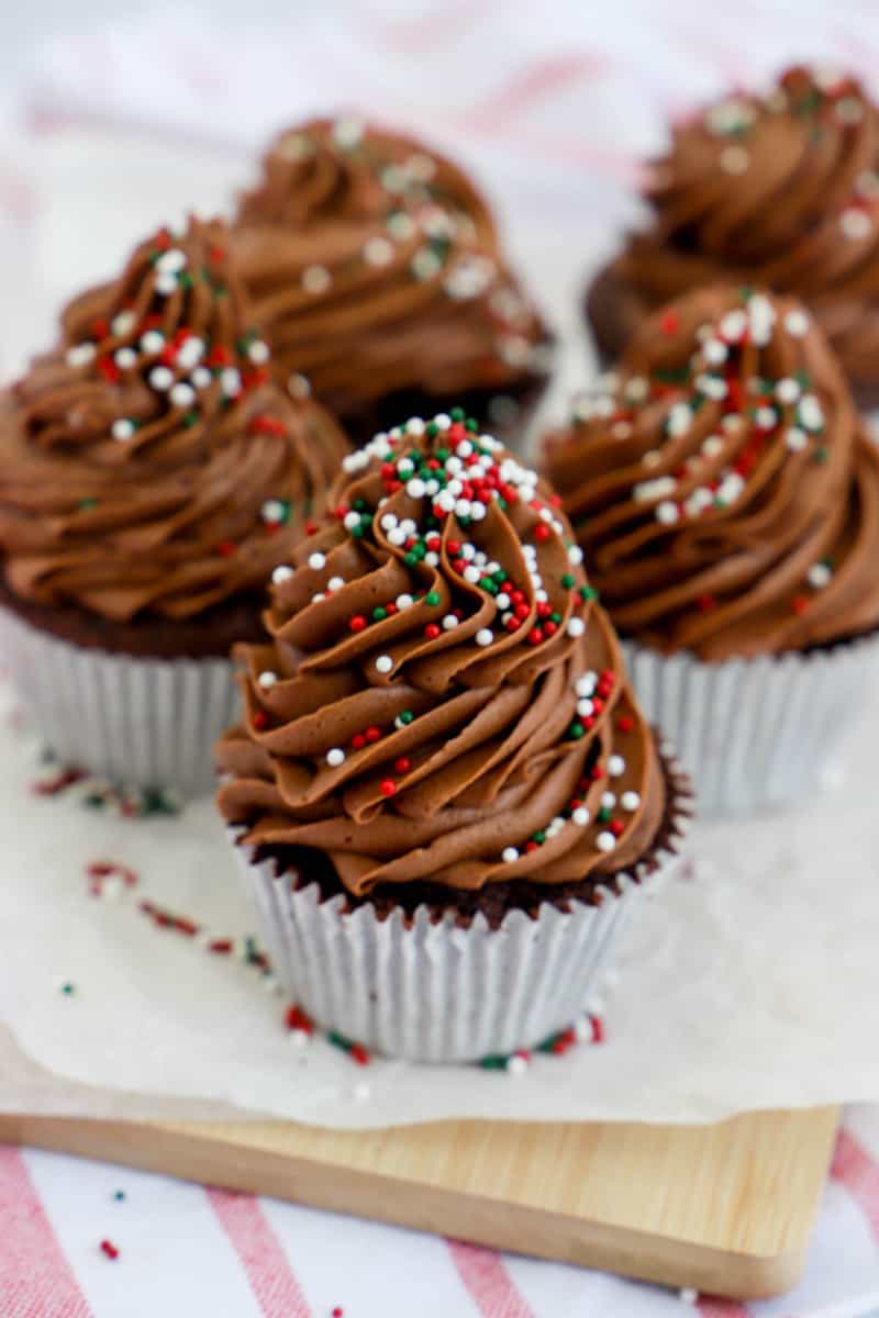 closeup of cupcakes on a wooden board