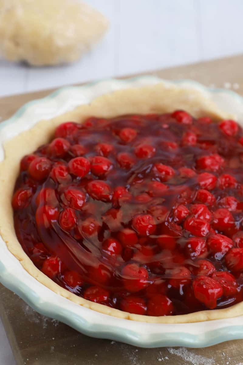 making a cheery pie with the homemade pie crust