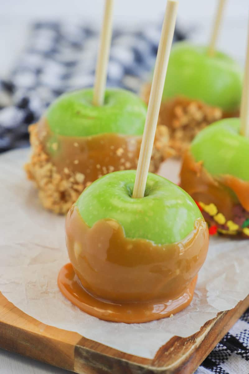 dipped apples on wooden tray