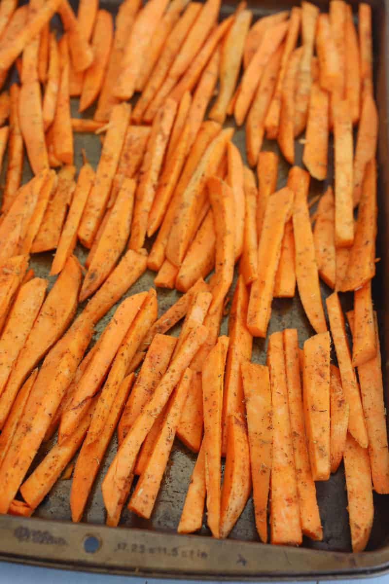 sweet potato fries laid out on a baking sheet