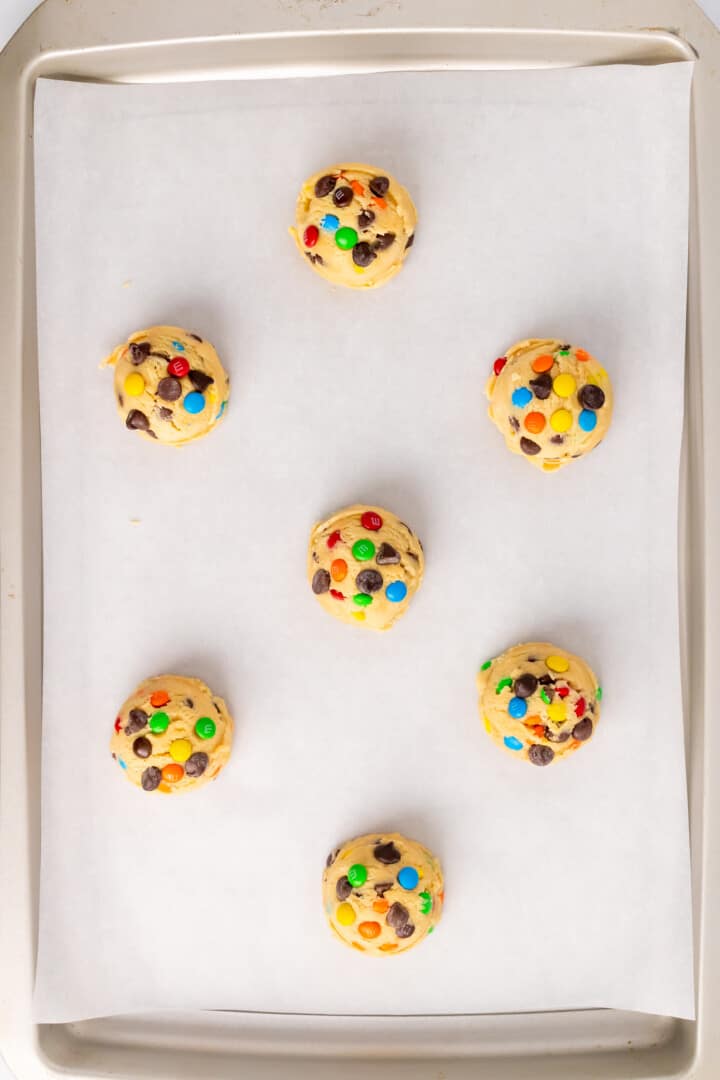 rolled cookie dough into balls on a baking sheet