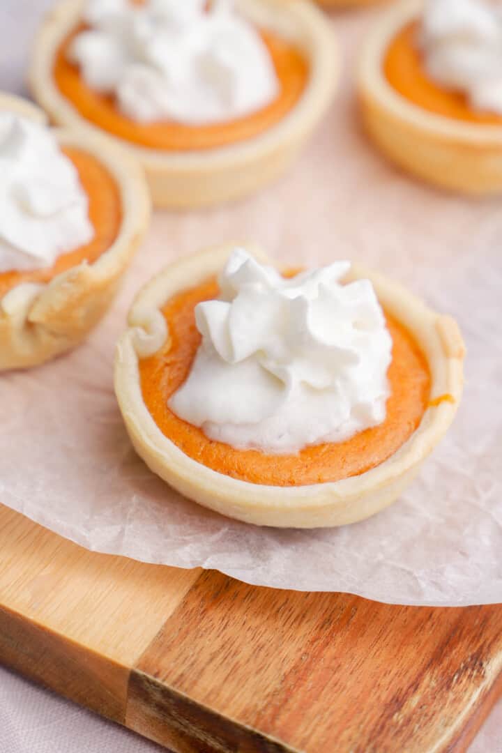 Mini Pumpkin Pies on wooden board