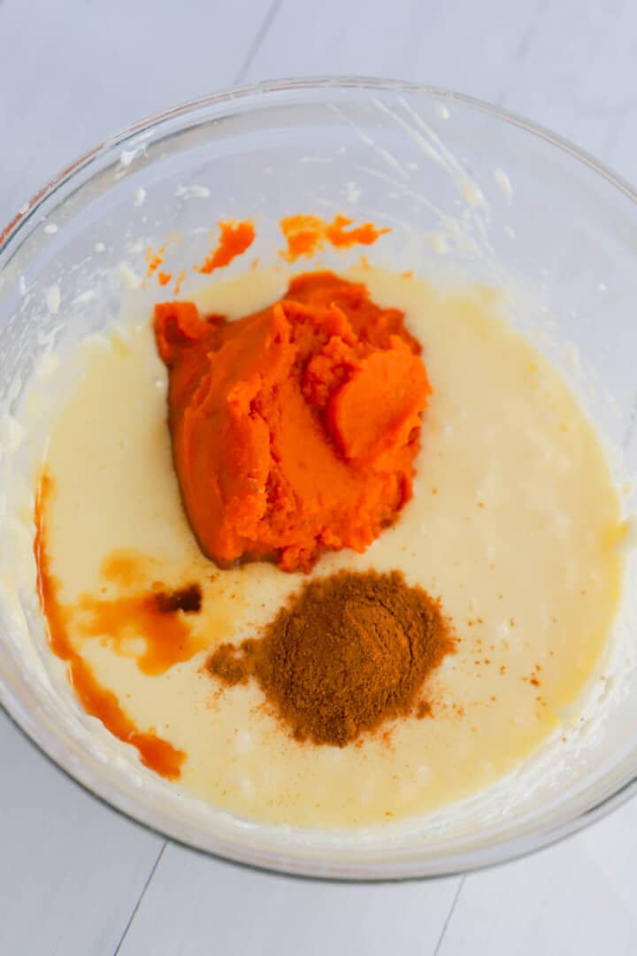 adding pumpkin puree and spice to the mix