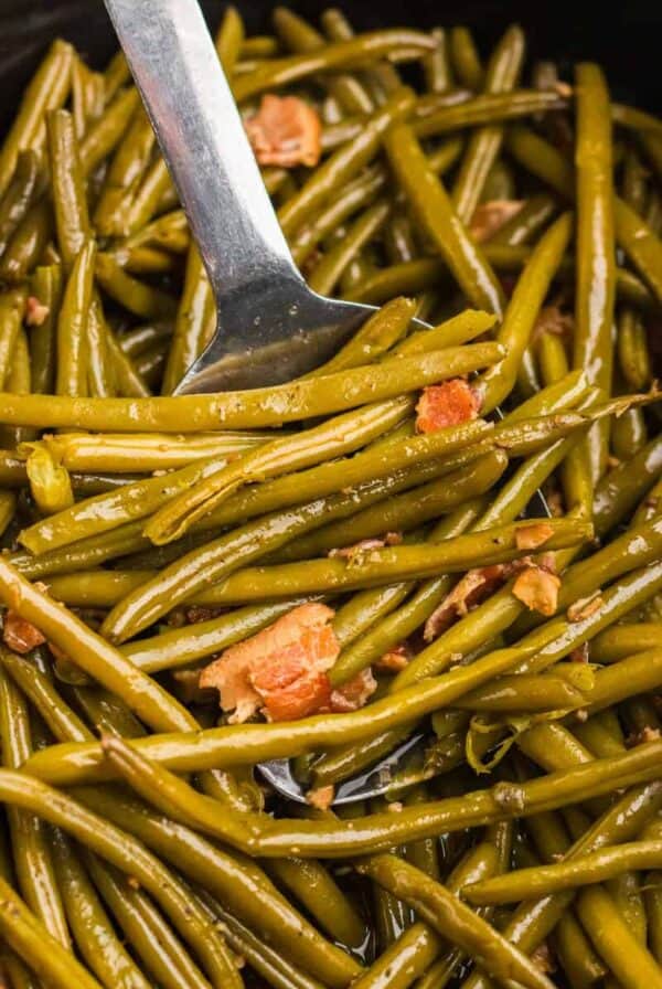 slow cooker green beans in slow cooker with spoon