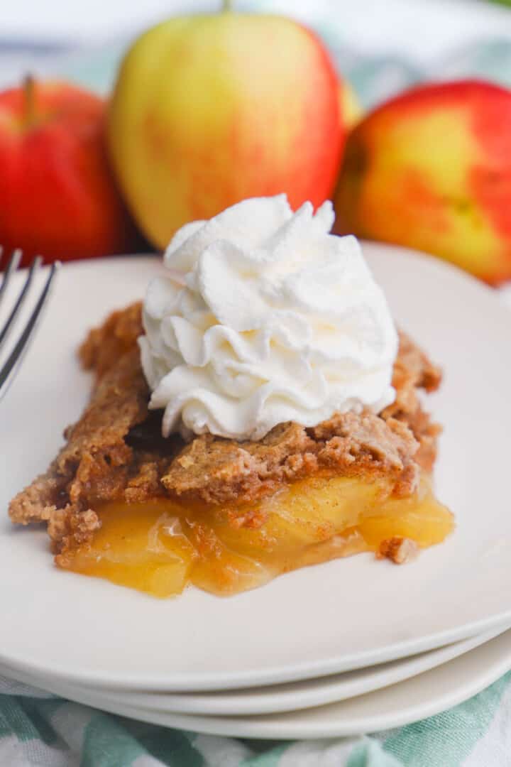 3 Ingredient Apple Spice Dump Cake on stacked white plates