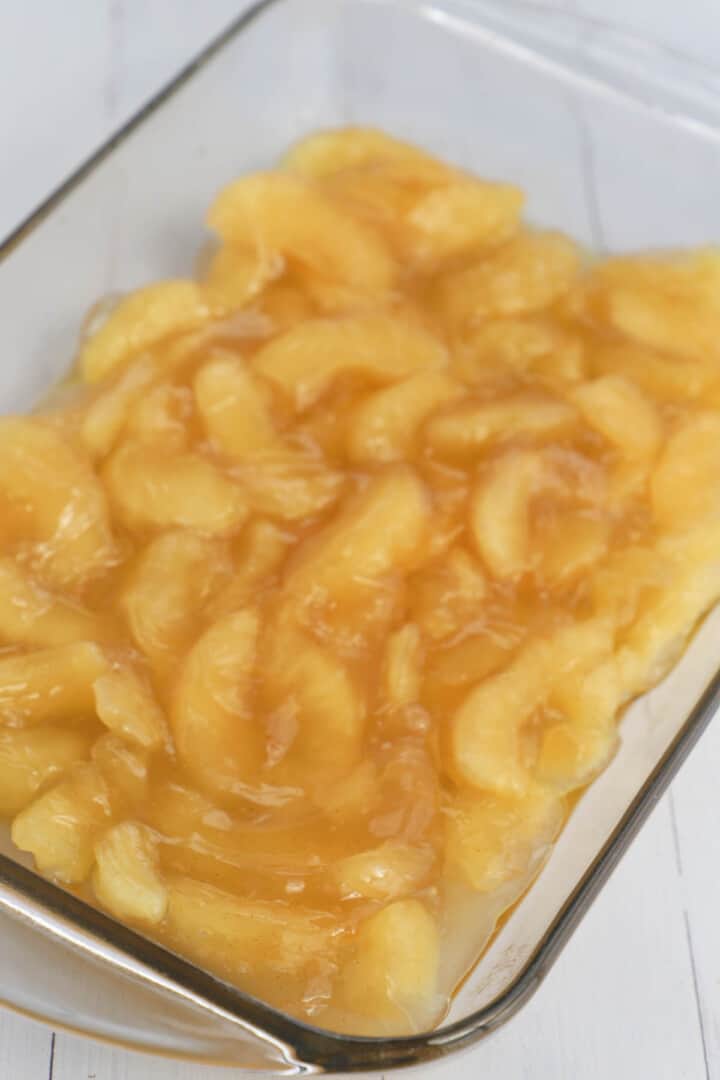 spreading apple pie filling into casserole dish