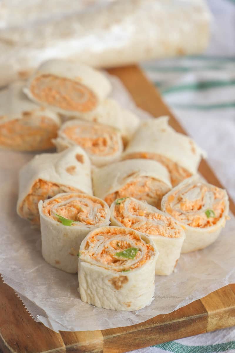Buffalo Chicken Pinwheels on wooden serving board
