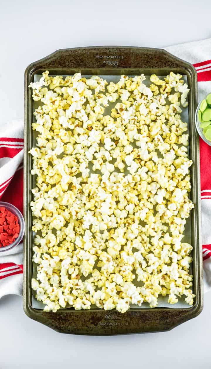 popped popcorn on a baking sheet