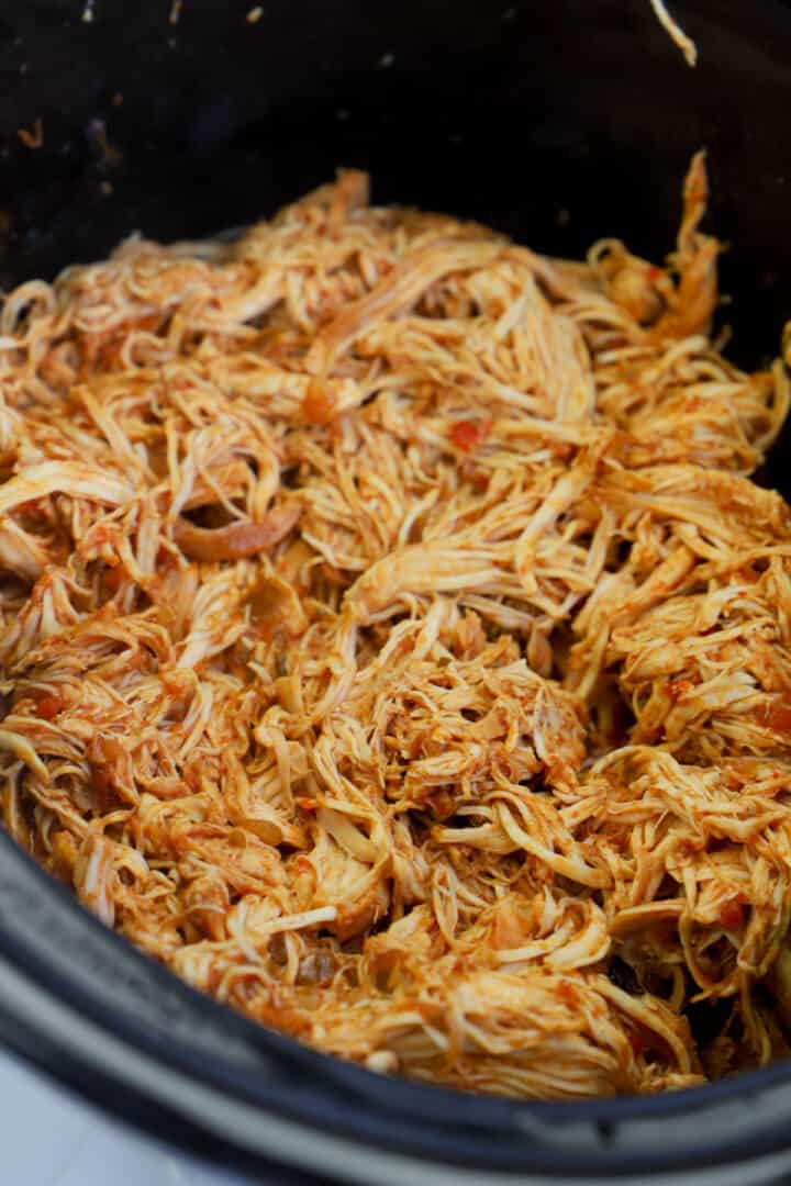 cooked cilantro lime chicken shredded in slow cooker