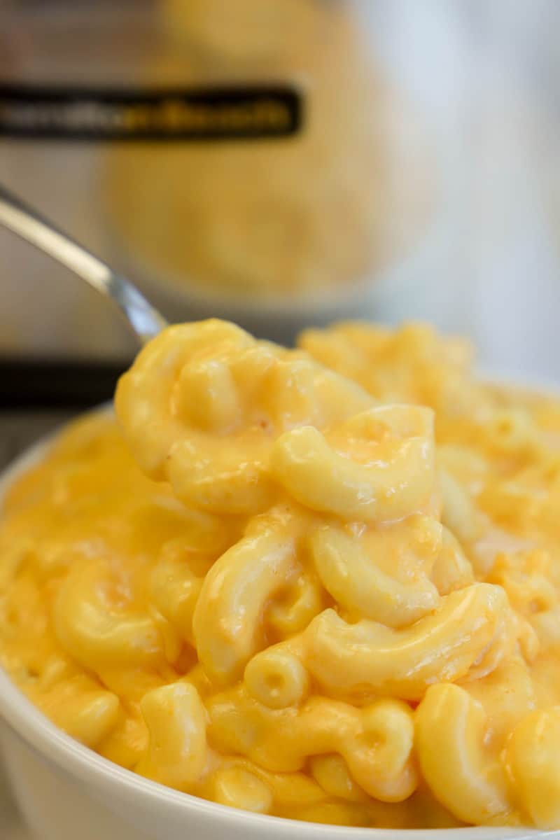 close up of slow cooker mac and cheese in white bowl