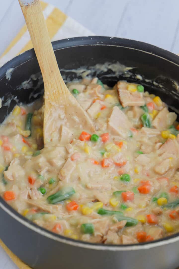 turkey pot pie filling being cooked on stove top