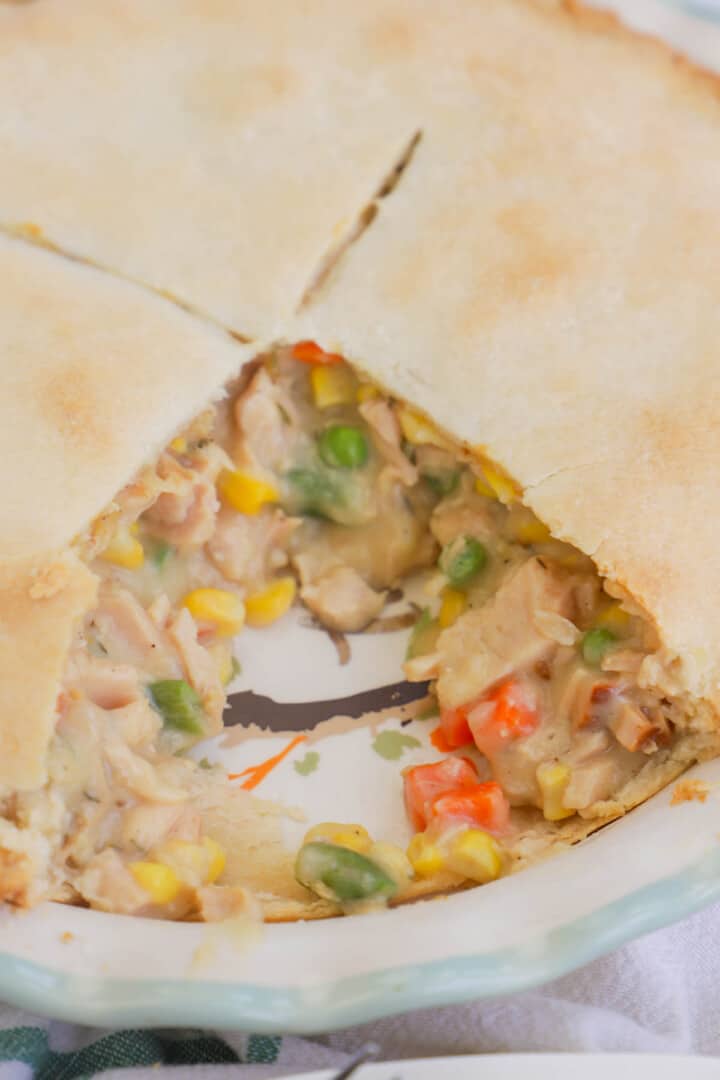 cooked turkey pot pie with slice out of it