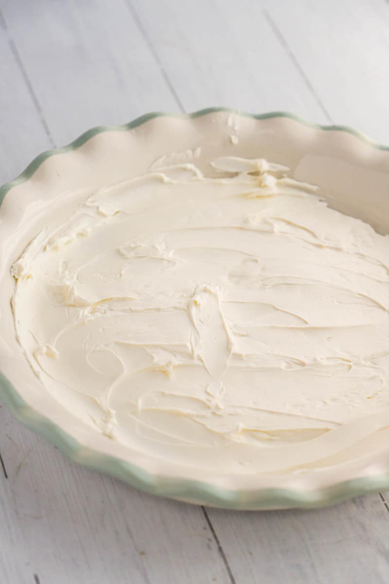 cream cheese spread on the bottom of the baking dish