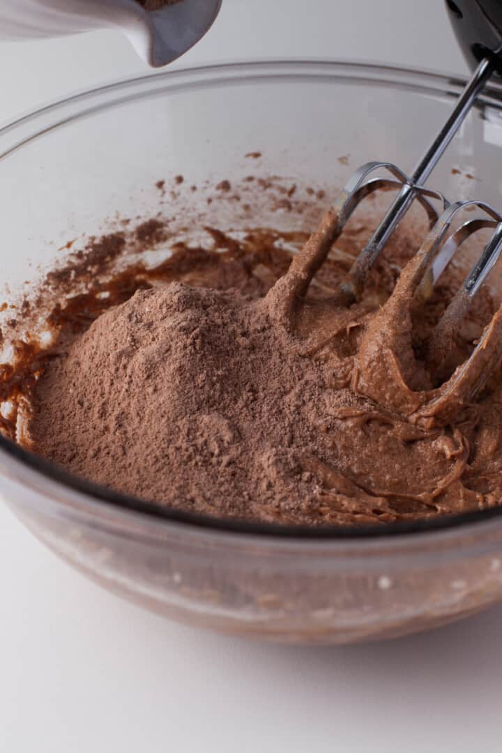 mixing the wet and dry ingredients to make the cookie dough