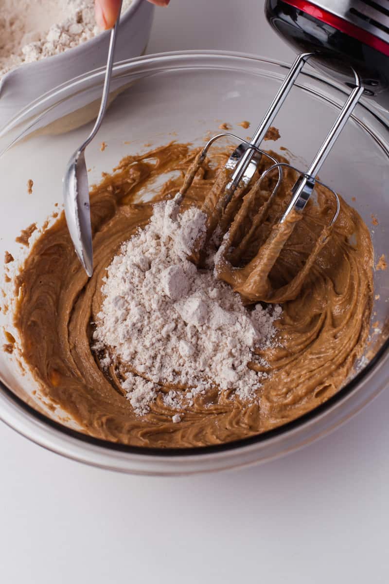 mixing the wet and dry ingredients together.