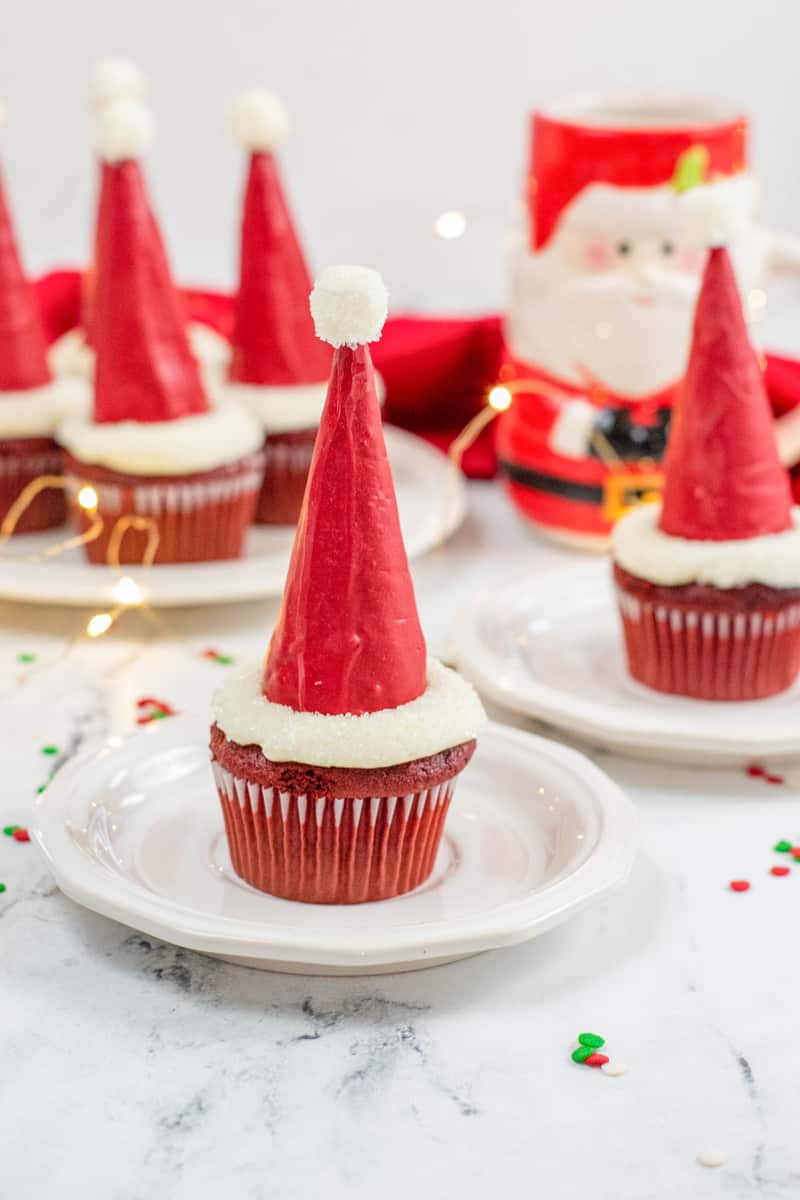 Santa Hat Cupcakes on white plates