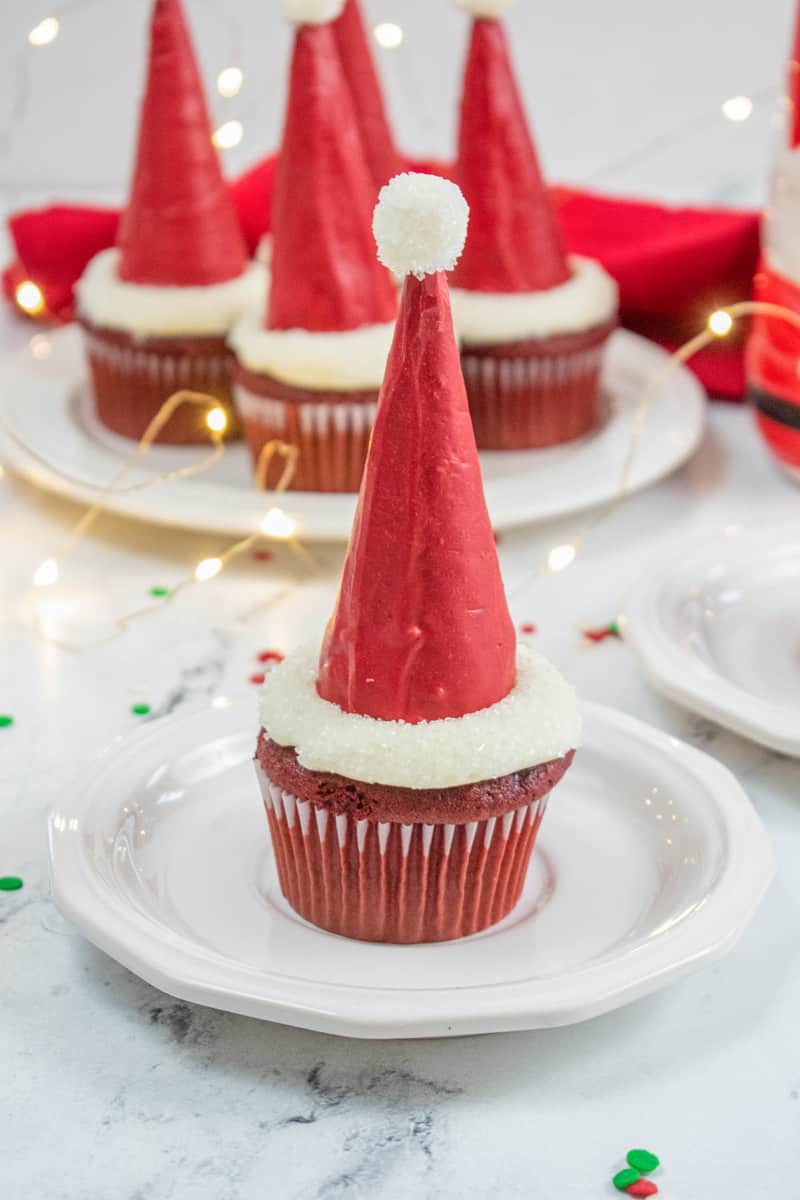closeup of Santa hat cupcake on white plate