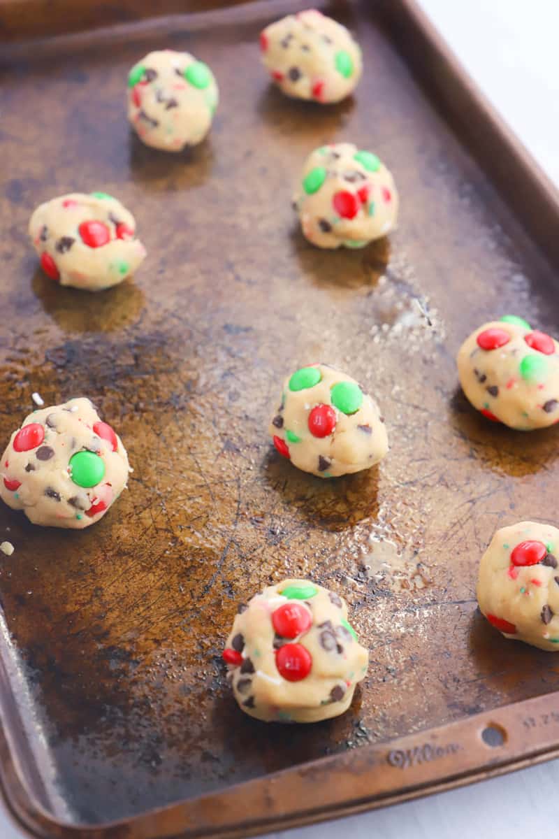 cookie dough in balls on baking sheet