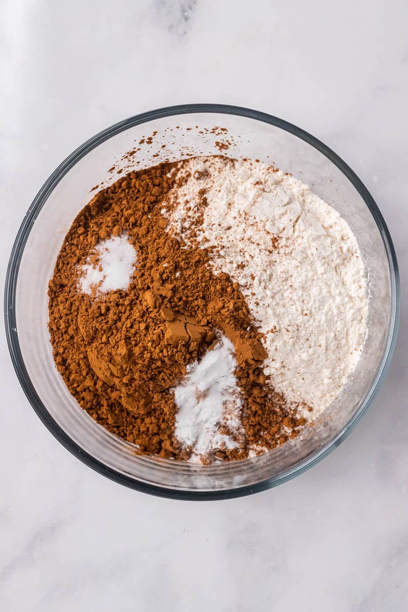 mixing flour, salt, baking soda and cocoa powder together for cookies