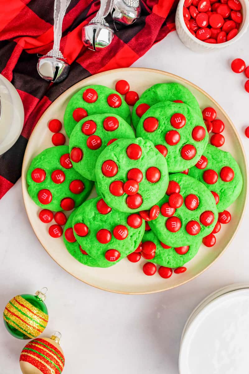 grinch cookies on white plate stacked