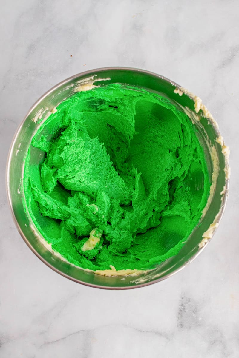 adding green dye to cookie dough